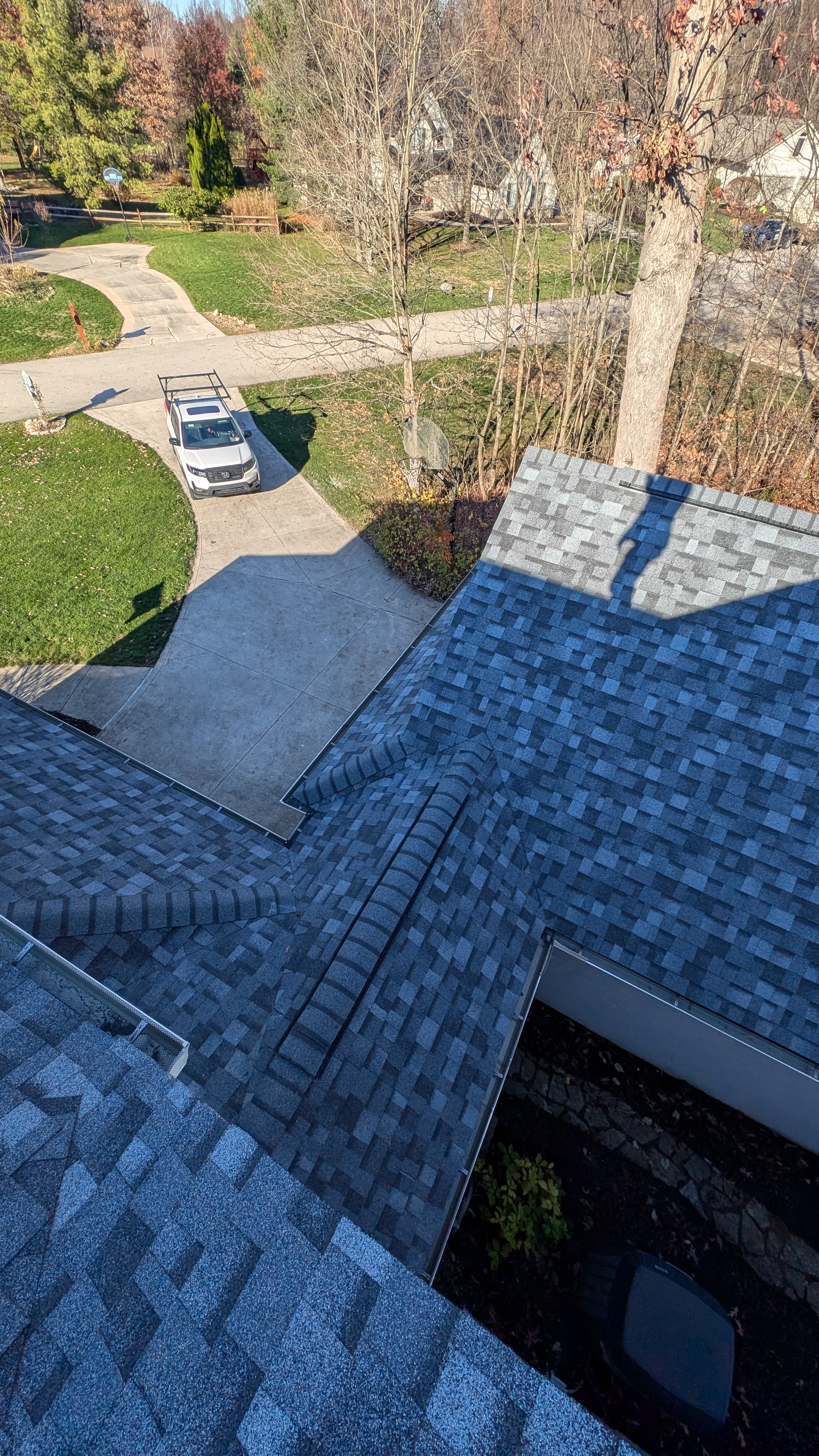High-end blue-tinted architectural shingle installation